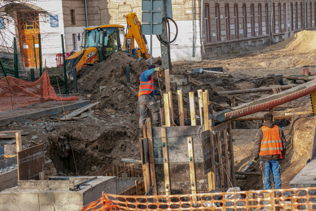 construction of a high rise building. pouring of foundation columns with concrete.